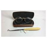Eye glasses and a shoe button hook