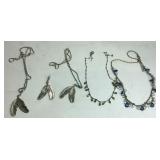 Four necklaces and a feather pendant