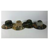 Four Camo and mesh hats, each a different