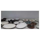 Group of plates, serving platter, bowls, and
