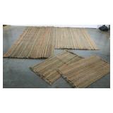 Group of four braided throw rugs, 4