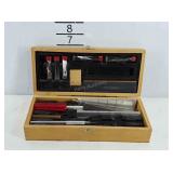 Small wooden toolbox with hobby knife blades,