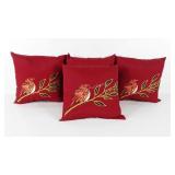 Four indoor outdoor bird themed pillows, one