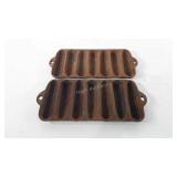 Two cast iron cornbread molds, 6" x 12", both