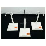 Three American Girl doll display stands,