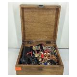 Caved wooden jewelry box with jewelry