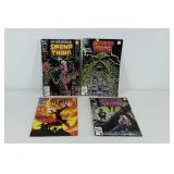 DC comic books, three Swamp Thing and one The