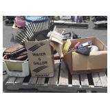 Skid of: welcome sign, camping lantern,