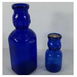 Cobalt blue glass, two Brookefield baby face milk