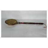 Brass and wood bed warmer. Measures 33" long.