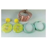 Two pairs of earrings and a multi beaded bracelet