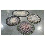 Four braided scatter rugs, earthy tones, rounds