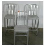 Three brushed aluminum chairs, two bar height 24"