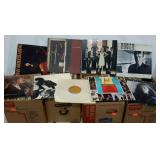 Four boxes of assorted 33RPM records. Mixed