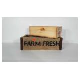 Wooden crates. One says FARM FRESH and one has a