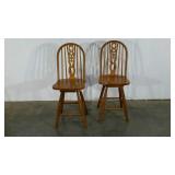 Two swivel seat bar chairs, 25" to seat, one is