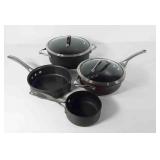 Calphalon cookware, four pans, two lids,