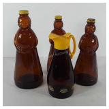 Glass syrup bottles, includes three Aunt Jemima