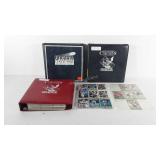 Three football collector card binders full of