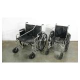 Two wheel chairs and an aluminum cane, seat