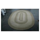 Oval braided rug, neutral colors, 88 x 62