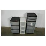 Three plastic storage tower stands, tallest is