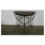 Half moon table, top is a little loose, needs