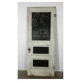 Older door painted with paint to use as a menu