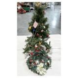 Small artificial Christmas tree and wreath.