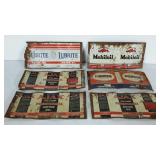 Six motor oil cans, flattened, rusty as shown,