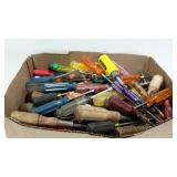 Flat full of assorted screwdrivers and nut