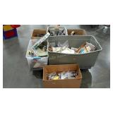 Skid lot of toys, ephemera, VHS tapes, books,