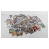 Cards, game and trading, all in sleeves, includes