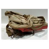Cyclone, hand crank seed sower. Dated 1955, bag