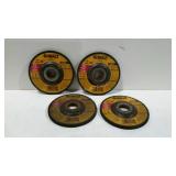 Four Dewalt 4.5" metal grinding wheels.