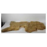 Sheep skin rug, with wear to back, 48" × 26"