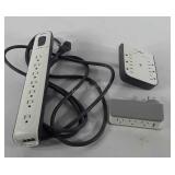 Three Belkin surge protectors