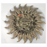 Metal face wall hanging,  25" across