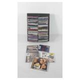 CDs, approximately 70 CDs, artists include 
Lucy