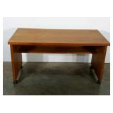 Low desk or work table, on wheels. 48"×24"×26".