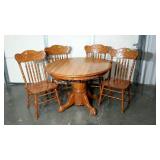 Claw footed pedestal table and four pressed back