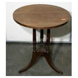 Round tri-footed occasional table. Missing two of
