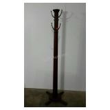 Coat rack. Has some wobble, needs adjustment.