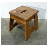 Oak step stool with hole for carrying.