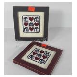 Two needlework wall hangings, each measures  8x8