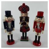 Christmas decor, three wooden nutcrackers, one