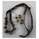Sleigh bells, brass and leather