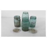 Ball Mason jars and two glass lids, all need