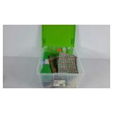 Craft supplies in 16 qt. tote, holiday fabric