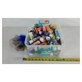 Tote full of craft paints, colored feathers